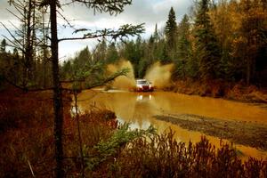 Henry Joy IV / Chris Griffin Mitsubishi Lancer Evo II at the midpoint water crossing on SS2, Herman.