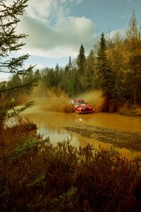 Rhys Millen / Lauchlin O'Sullivan Mitsubishi Lancer Evo 6.5 at the midpoint water crossing on SS2, Herman.