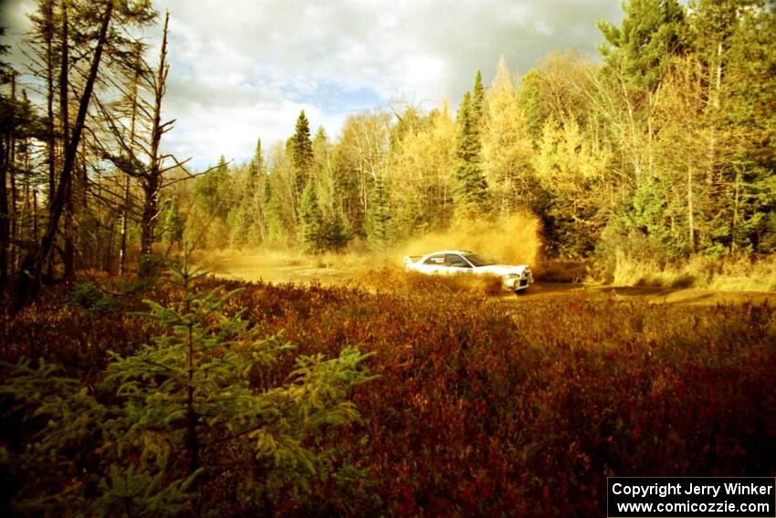 Seamus Burke / Frank Cunningham Mitsubishi Lancer Evo VI at the midpoint water crossing on SS2, Herman.