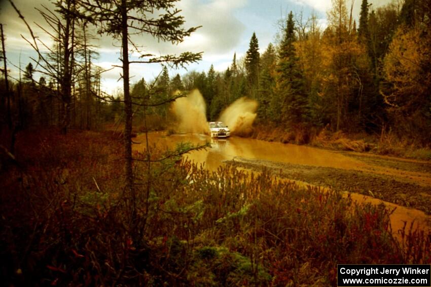 Tim Paterson / Scott Ferguson Mitsubishi Lancer Evo IV at the midpoint water crossing on SS2, Herman.