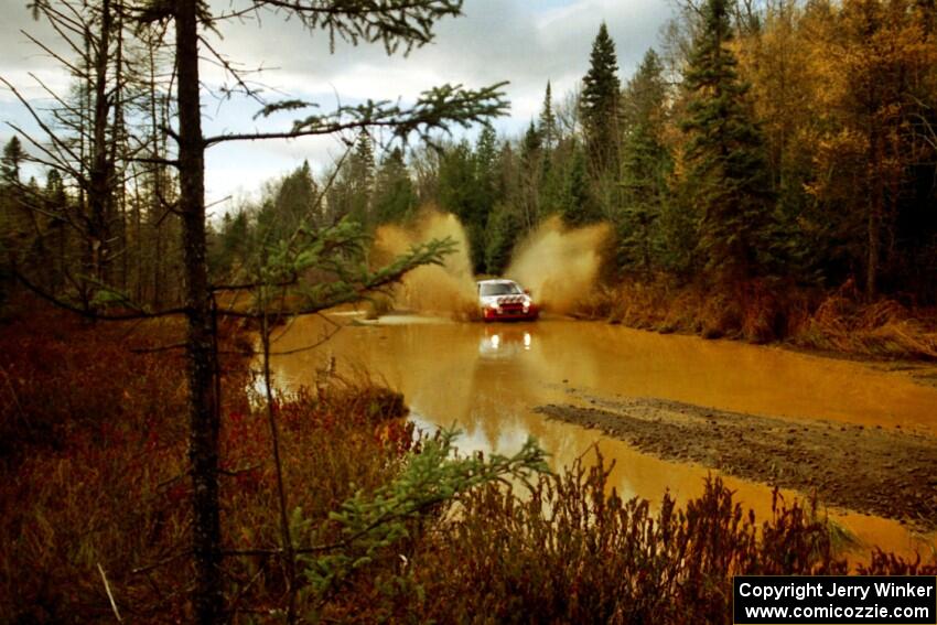 Henry Joy IV / Chris Griffin Mitsubishi Lancer Evo II at the midpoint water crossing on SS2, Herman.