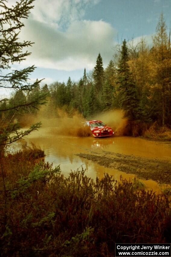 Rhys Millen / Lauchlin O'Sullivan Mitsubishi Lancer Evo 6.5 at the midpoint water crossing on SS2, Herman.