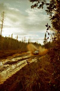 Mike Hurst / Rob Bohn Ford Mustang at the midpoint water crossing on SS2, Herman.