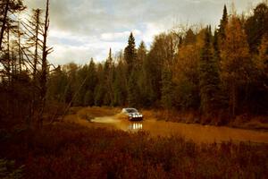 Mike Halley / John Dillon VW New Beetle at the midpoint water crossing on SS2, Herman.