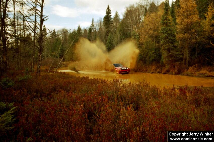 Mark Utecht / Brenda Lewis Mitsubishi Eclipse GSX at the midpoint water crossing on SS2, Herman.