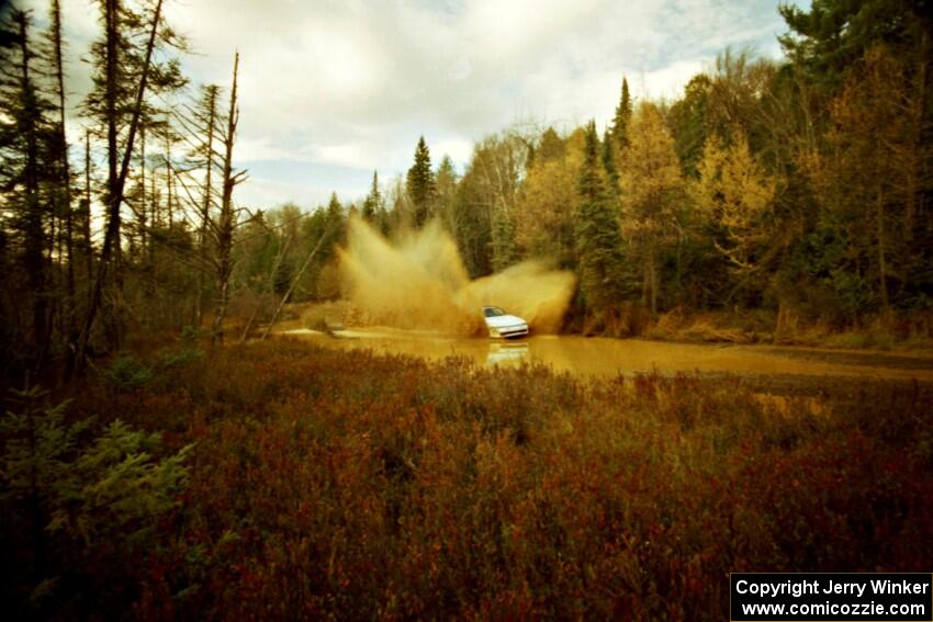 Chris Czyzio / Eric Carlson Mitsubishi Eclipse GSX at the midpoint water crossing on SS2, Herman.