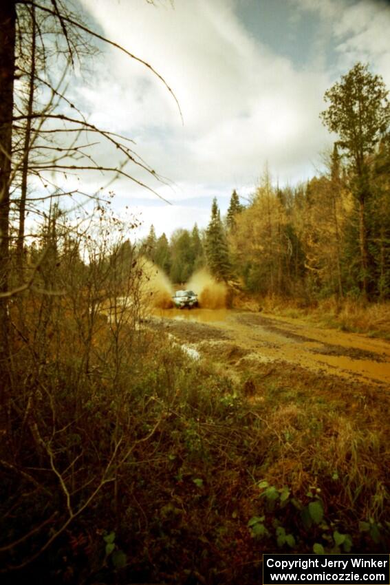 Tad Ohtake / Bob Martin Ford Escort ZX2 at the midpoint water crossing on SS2, Herman.