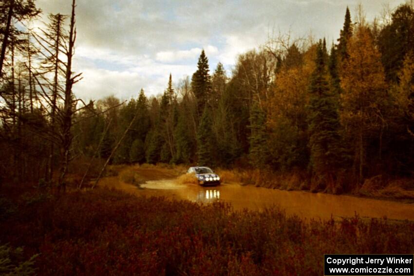 Mike Halley / John Dillon VW New Beetle at the midpoint water crossing on SS2, Herman.