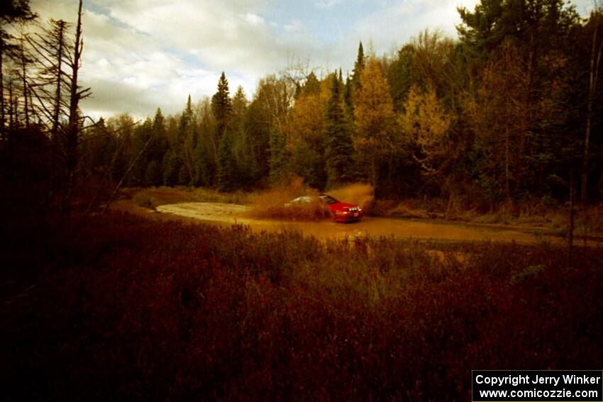 Jouni Pohjolainen / John Matikainen Eagle Talon at the midpoint water crossing on SS2, Herman.