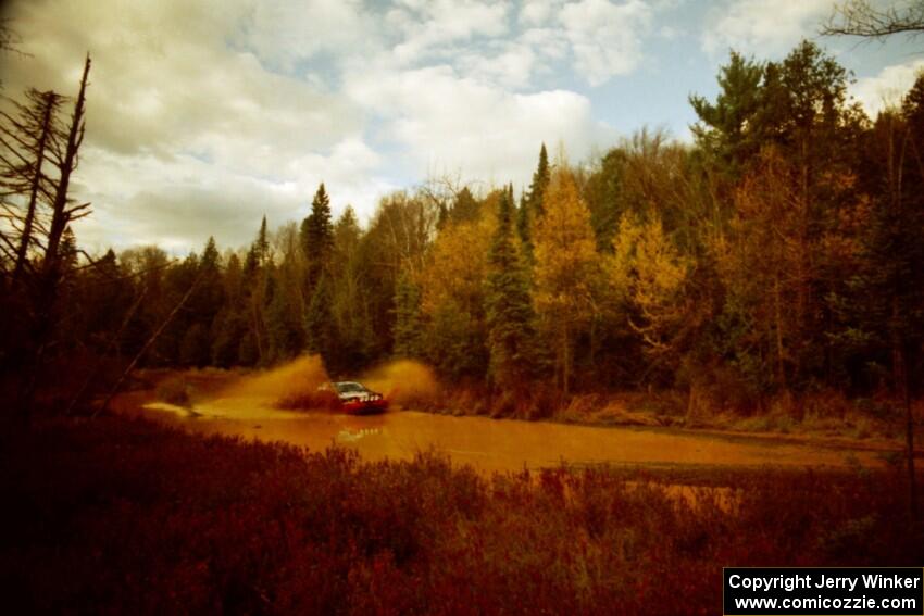 Dennis Martin / Chris Plante Mitsubishi Eclipse GSX at the midpoint water crossing on SS2, Herman.