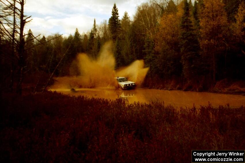 Jon Hamilton / Josh Westhoven VW Rabbit at the midpoint water crossing on SS2, Herman.