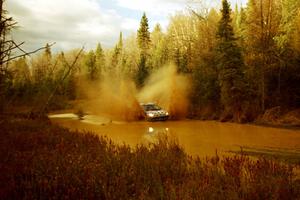 Tom Young / Jim LeBeau Dodge Neon ACR at the midpoint water crossing on SS2, Herman.