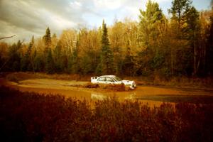 Paul Dunn / Rebecca Dunn Mitsubishi Lancer Evo IV at the midpoint water crossing on SS2, Herman.