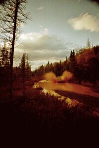 Paul Flores / Sean Figgins Nissan Pickup at the midpoint water crossing on SS2, Herman.