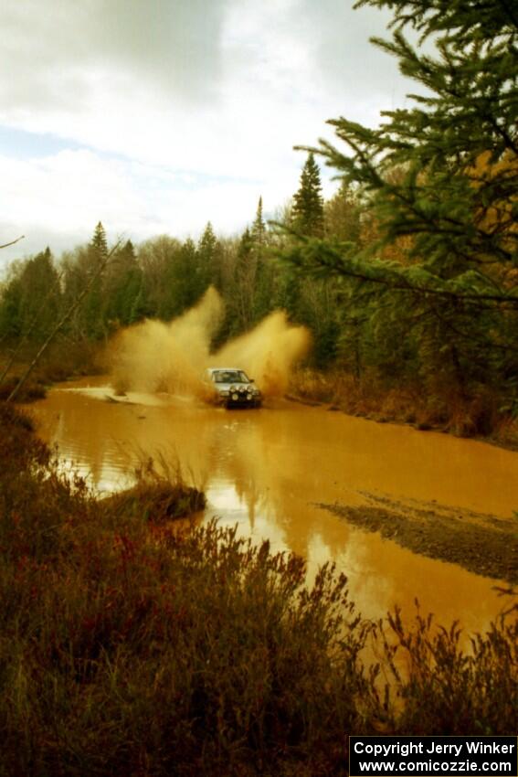 Chris Whiteman / Mike Paulin VW GTI at the midpoint water crossing on SS2, Herman.