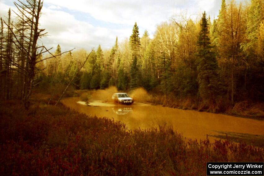 Art Burmeister / Dave Weiman VW GTI at the midpoint water crossing on SS2, Herman.