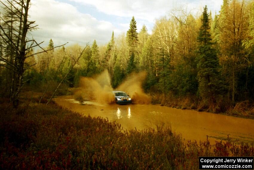 Craig Peeper / Ian Bevan Ford Focus at the midpoint water crossing on SS2, Herman.