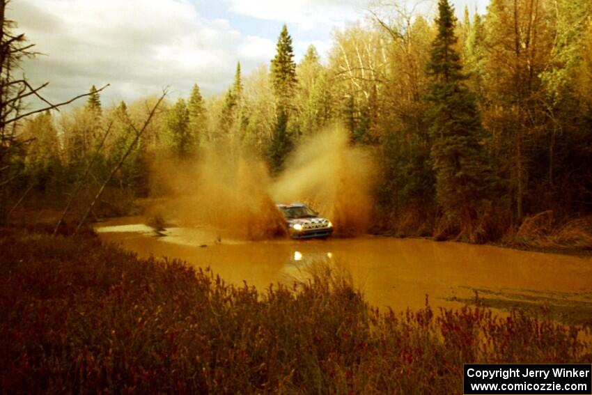 Tom Young / Jim LeBeau Dodge Neon ACR at the midpoint water crossing on SS2, Herman.