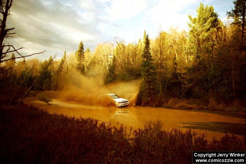 Todd Jarvey / Rich Faber Mitsubishi Galant VR-4 at the midpoint water crossing on SS2, Herman.