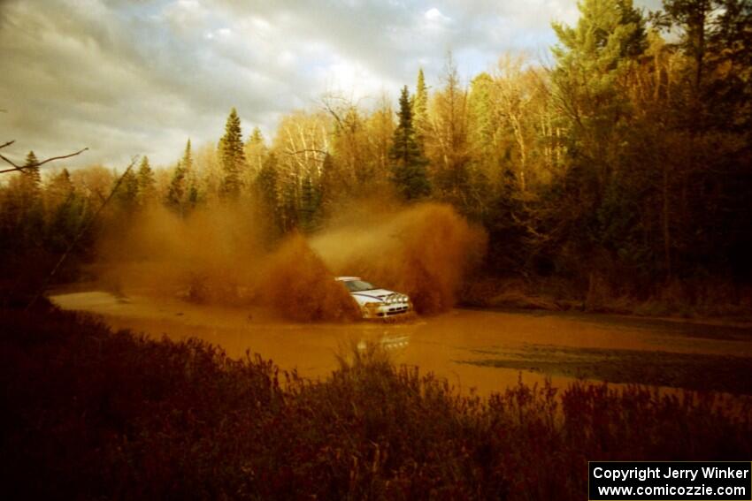 Chris Gilligan / Joe Petersen Mistubishi Eclipse GSX at the midpoint water crossing on SS2, Herman.