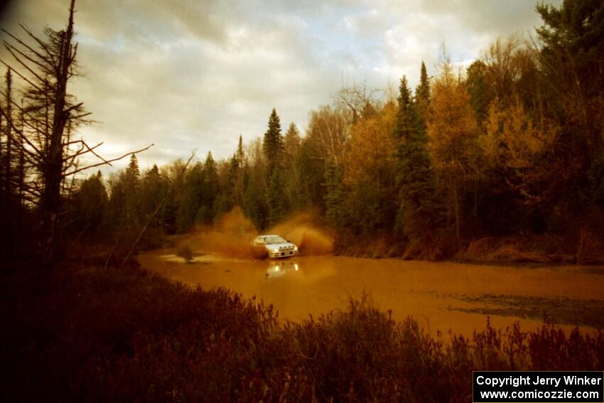 Greg Healey / John MacLeod Subaru Impreza at the midpoint water crossing on SS2, Herman.