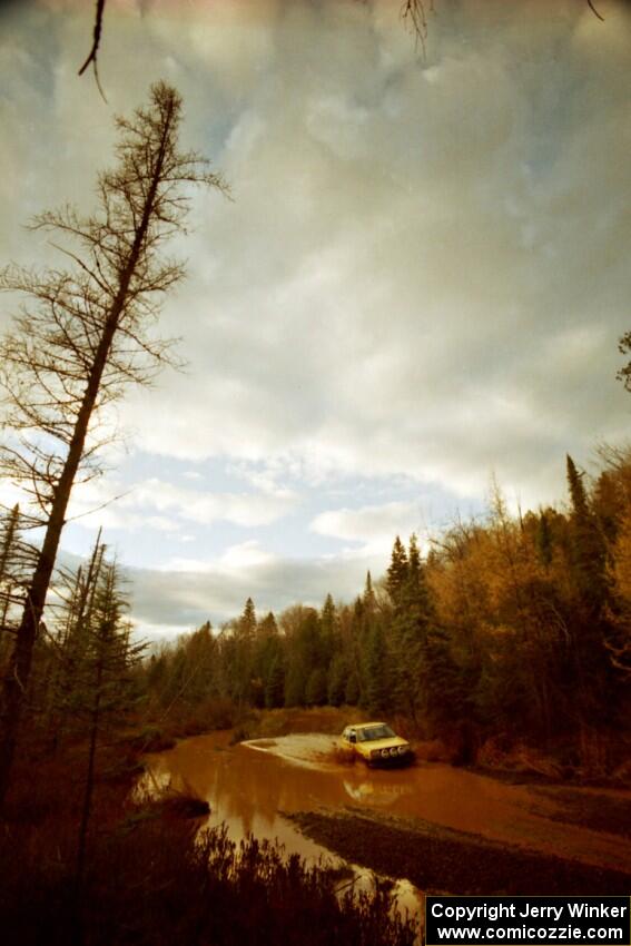 Mark Buskirk / Paul Fernandez VW GTI at the midpoint water crossing on SS2, Herman.