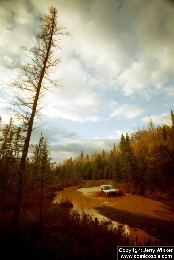 Doug Davenport / Lea Davenport VW GTI at the midpoint water crossing on SS2, Herman.