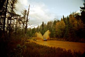 Dan Moore / John Hopponen Suzuki Swift GTi at the midpoint water crossing on SS2, Herman.