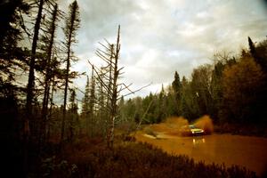 Alex Timmermans / Jason Mendez Datsun 510 at the midpoint water crossing on SS2, Herman.