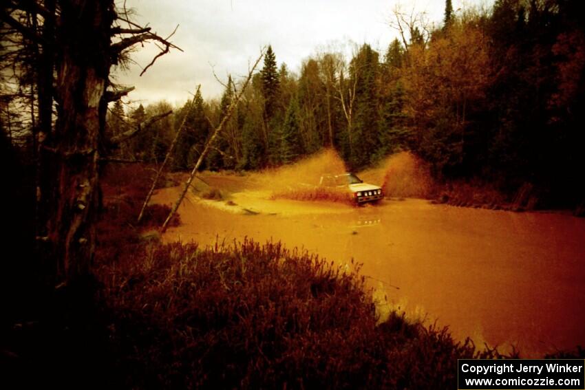 Bryan Ackerman / Sumit Panjabi Mitsubishi Mighty Max at the midpoint water crossing on SS2, Herman.