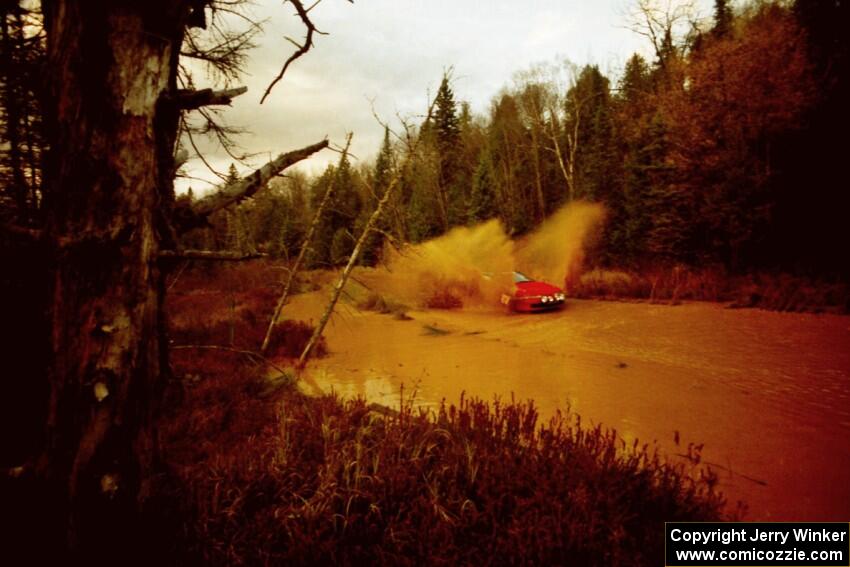 Dave LaFavor / Bob LaFavor Eagle Talon at the midpoint water crossing on SS2, Herman.