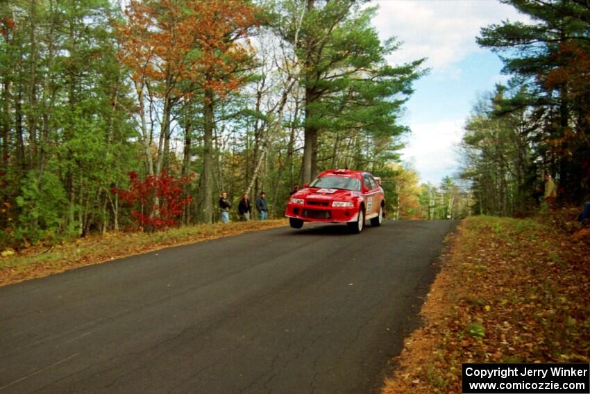 Rhys Millen / Lauchlin O'Sullivan Mitsubishi Lancer Evo 6.5 catches air at the midpoint jump on SS16, Brockway Mt.