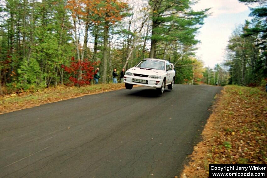 Pat Richard / Ben Bradley Subaru WRX STi catches air at the midpoint jump on SS16, Brockway Mt.