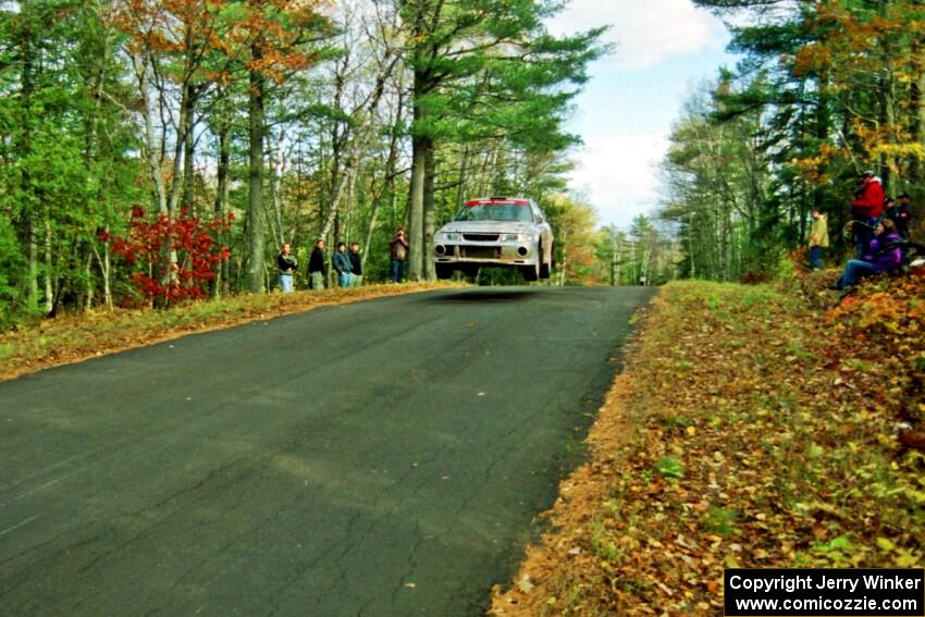 Mark Nelson / Alex Gelsomino Mitsubishi Lancer Evo VI catches air at the midpoint jump on SS16, Brockway Mt.