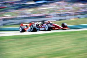 Eddie Cheever's Lola T-92/00/Ford Cosworth XB and Paul Tracy's Penske PC-21/Chevy