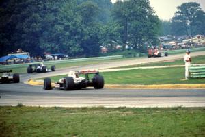 The top four head through turn 3 during the final laps.