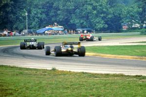 The top three head through turn 3 on the final lap.