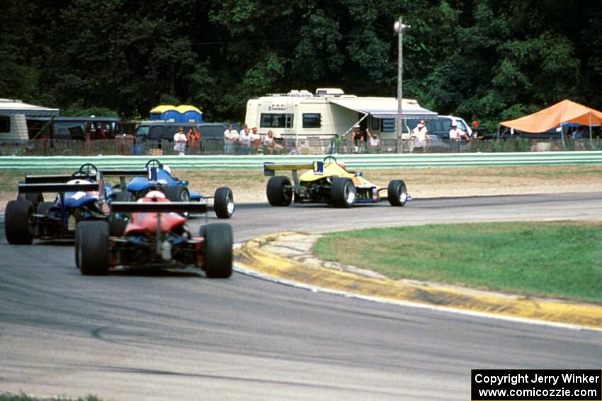 Five Mondiale Formula SAABs battle in turn 3.