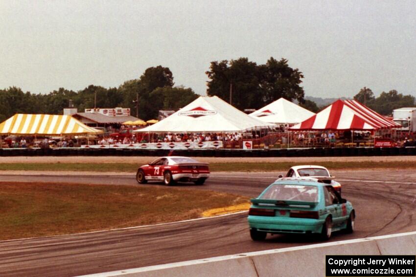 Elliott Forbes-Robinson's Nissan 300ZX Turbo, Nick Ham's Porsche 911 Turbo and Andy Pilgrim's Ford Mustang Saleen SC