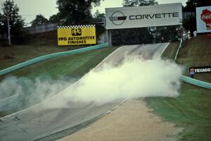 Richard Holdener's Ford Mustang Cobra smokes heavily out of turn 5.