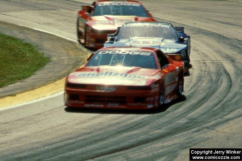 Tommy Archer's Dodge Daytona, Ron Fellows' Ford Mustang and Bobby Archer's Dodge Daytona