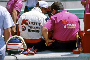Nigel Mansell converses with Carl Haas
