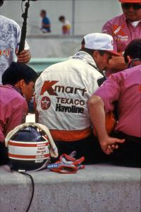 Nigel Mansell converses with Carl Haas