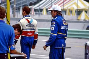 Al Unser, Jr. and Danny Sullivan on pit lane.