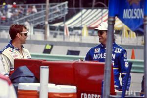 Al Unser, Jr. and Danny Sullivan on pit lane.