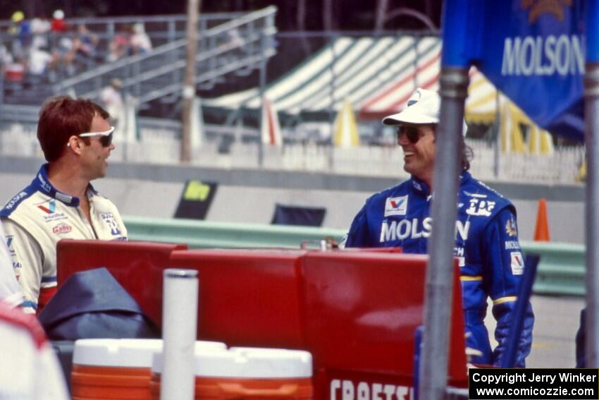 Al Unser, Jr. and Danny Sullivan on pit lane.