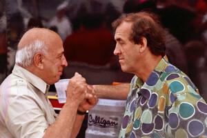 Mike Rahal and David Hobbs converse in the paddock.