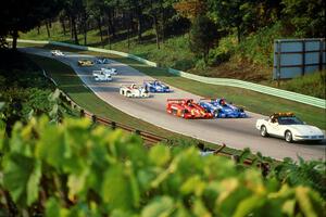 The Shelby Can-Am field comes uphill into turn 13 on the pace lap.
