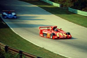 The Shelby Can-Am cars of Scott Harrington and Mike Davies battle for the lead.