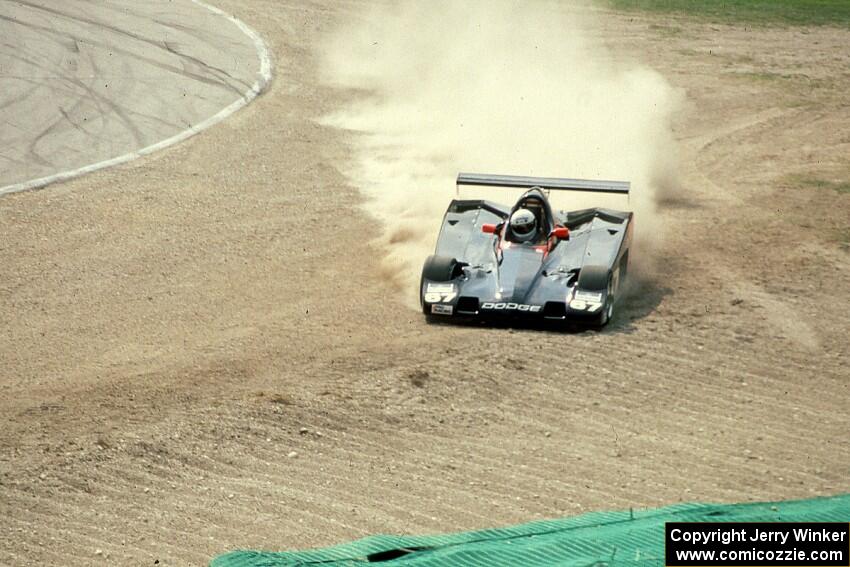 The Shelby Can-Am car of ??? slides off into the barrier at Canada Corner during qualifying.